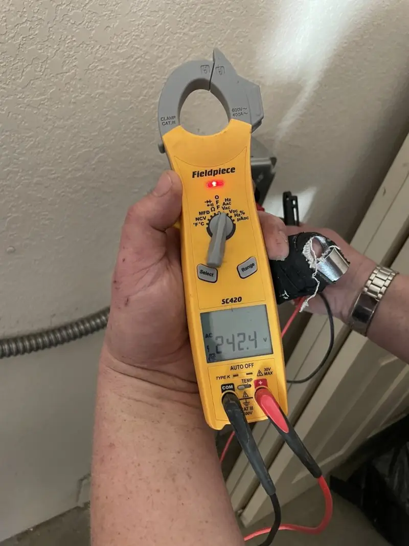 Voltage testing with clamp meter during Generator Installation in Dixon